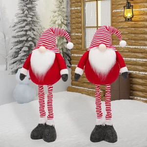 Christmas striped gnome dolls with long legs in a cozy snowy forest setting