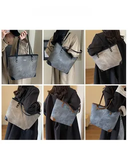 Detail showing multi-color marble textured large tote bags in PU leather with reinforced corners