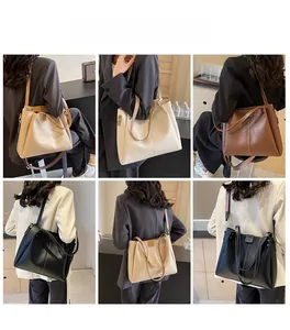 Tre colori di borsa tote capiente indossata con tracolla larga per l'uso quotidiano