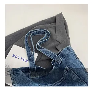 Detailed close-up of durable double-layer denim handles with vintage washed texture