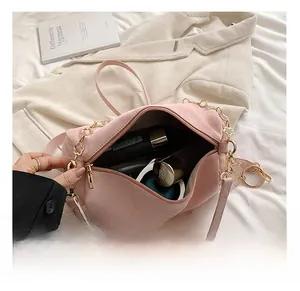 Pink suede Boston bag interior showing spacious large capacity for cosmetics