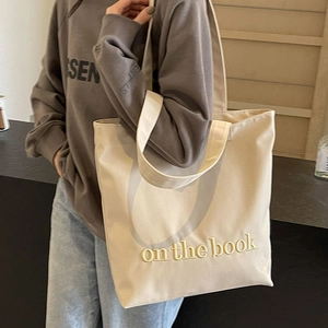 Chic beige canvas tote bag with on the book embroidery and large capacity design
