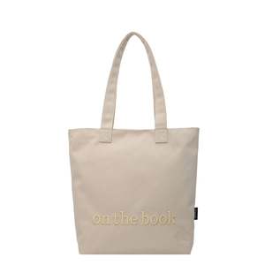 Minimalist beige canvas tote bag with book embroidery for commuting and school use
