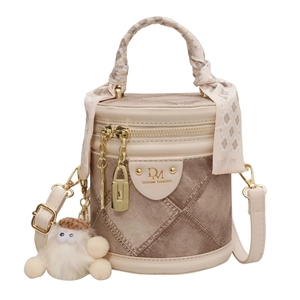 Designer cylindrical bucket bag in tan denim and beige leather with silk scarf handle
