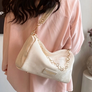 Chic beige velvet Boston bag with floral gold chain and branded wide shoulder strap