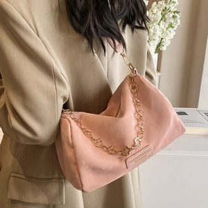 Pink suede-style Boston bag with a golden floral chain and detachable shoulder strap