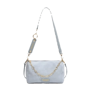 Minimalist light blue cylinder pillow handbag with golden chain strap on white background