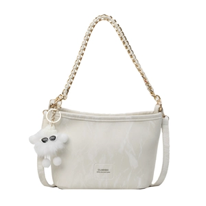 Cream marble texture bucket bag with chain strap and plush charm on white background