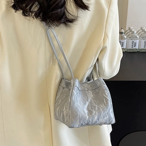 Elegant grey pleated bucket bag with dual thin straps and high-shine textured finish