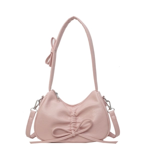 Pink crescent shoulder bag with elegant bow accents and detachable crossbody strap