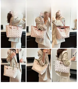 Detail view of large tote bag showing bow shoulder straps and horse print patterns