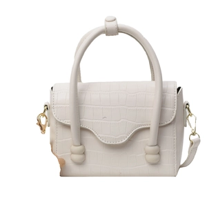 Creamy white crocodile texture handbag with unique cylindrical handles and gold hardware
