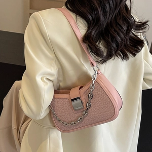 Pink woven half-moon underarm bag with silver chain strap and metal buckle for women