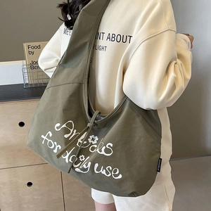 Olive green canvas hobo bag with drawstring and daily use print for casual wear
