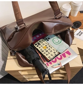 Spacious vintage brown tote bag showing capacity for laptop and daily essentials