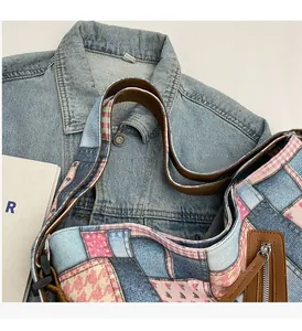 Detail of patchwork denim tote bag showing vintage fabric textures and brown handle