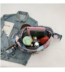 Spacious interior of patchwork denim tote bag showing striped lining and daily essentials