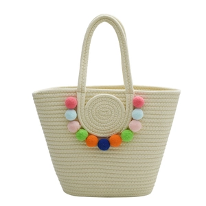 Large woven tote bag with colorful pom-poms for beach holidays and casual use