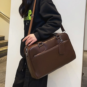 Vintage dark brown leather tote bag with adjustable strap and multi-pocket design