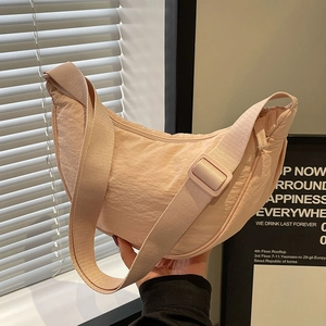 Large capacity pale peach nylon half-moon crossbody bag with adjustable wide strap