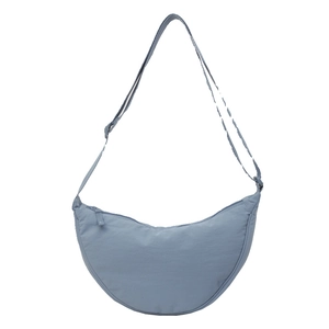 Minimalist light blue crescent crossbody bag made of durable nylon with adjustable strap