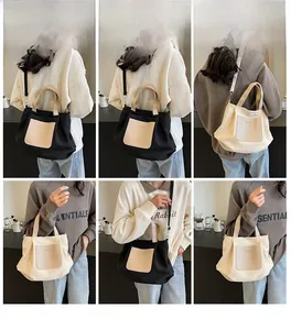 Détail du grand sac cabas en nylon avec poche en cuir montrant les styles porté épaule et main