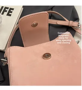 Detail of pink bucket bag featuring invisible magnetic buckle for easy opening