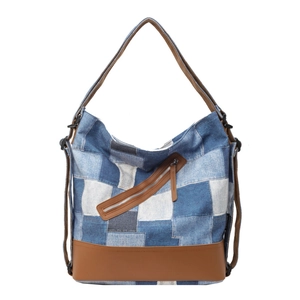 Retro patchwork denim tote bag with brown leather base and diagonal front zipper