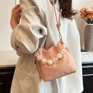 Pink pleated beaded handbag with pearl handle and shoulder strap for women