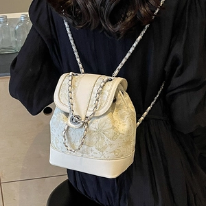 Women's beige mini backpack with gold butterfly print and elegant metal chain straps