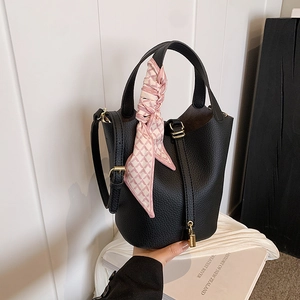 Classic black leather bucket bag with silk scarf handle and golden padlock charm