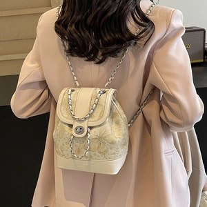 Chic cream mini backpack with gold butterfly print and elegant metal chain strap for women