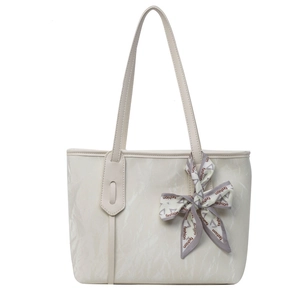 Large beige tote bag with marble texture and fashion silk scarf on handle for daily use