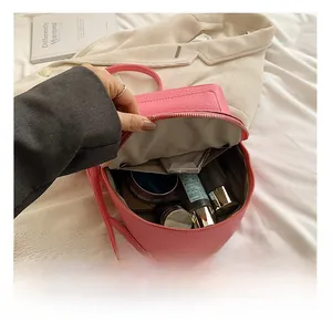 Pink lychee grain leather backpack interior showing spacious storage for cosmetics