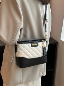 Quilted colorblock shoulder bag with black and white faux leather and gold chain detail