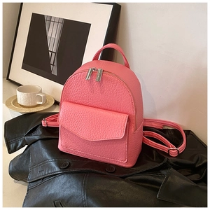 Detail of pink lychee leather texture and metal zipper on the mini ballet backpack