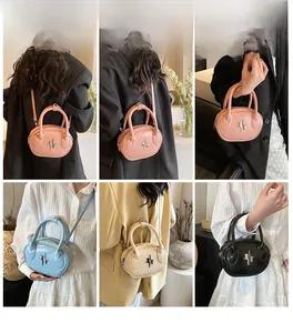 Detail view of mini oval PU leather handbags with star metallic decor in four soft colors