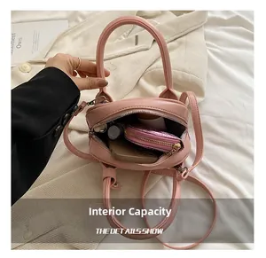Interior view showing the capacity of this pink PU leather crossbody bag for daily items