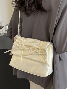Creamy white large tote bag with double bows and silk scarf detail on shoulder strap