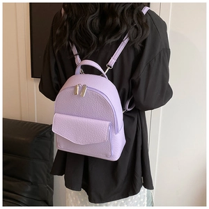 Detail of lavender pleated mini backpack with荔枝 texture and silver hardware chain