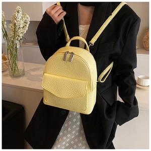Chic yellow ballet-style mini backpack with pleated texture and silver chain straps