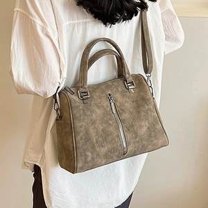 Minimalist brown large capacity tote bag with silver zipper and vintage leather texture