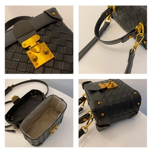 Detail of black woven bucket bag with vintage gold clasp and interior lining view