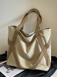 Large cream canvas tote bag with contrast brown strap details for stylish summer travel