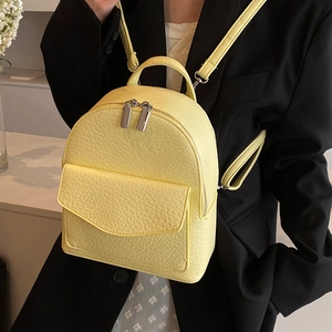 Chic pleated ballet style lemon yellow leather backpack with chain and metal zippers
