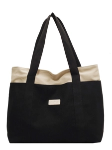 Large capacity canvas tote bag with black and white contrast design for casual daily use