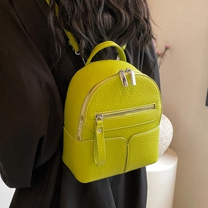 Mini lime green backpack for women in textured leather with silver metal zippers