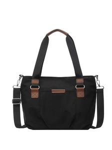 Black canvas tote bag with brown leather accents and adjustable shoulder strap