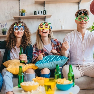 Group of friends wearing American football party glasses at a Super Bowl celebration