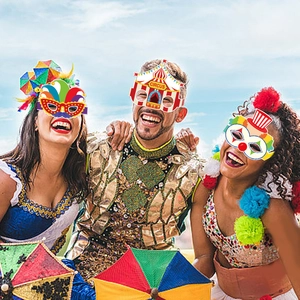 Three circus carnival themed paper party glasses featuring tent and clown hat designs